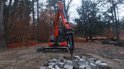 excavadora kubota kx057 con martillo hidráulico